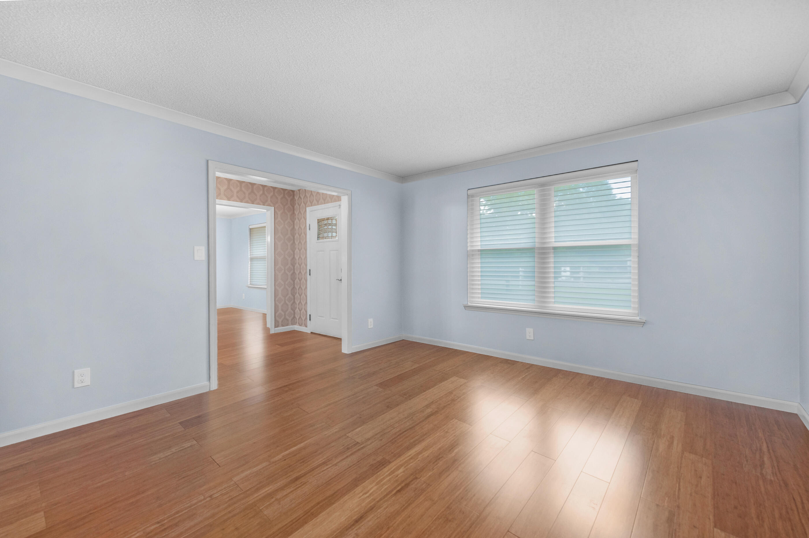 10099 Bellbrook Road Milton, FL 32583 - Photo 20 of 49 a view of an empty room with wooden floor and a window