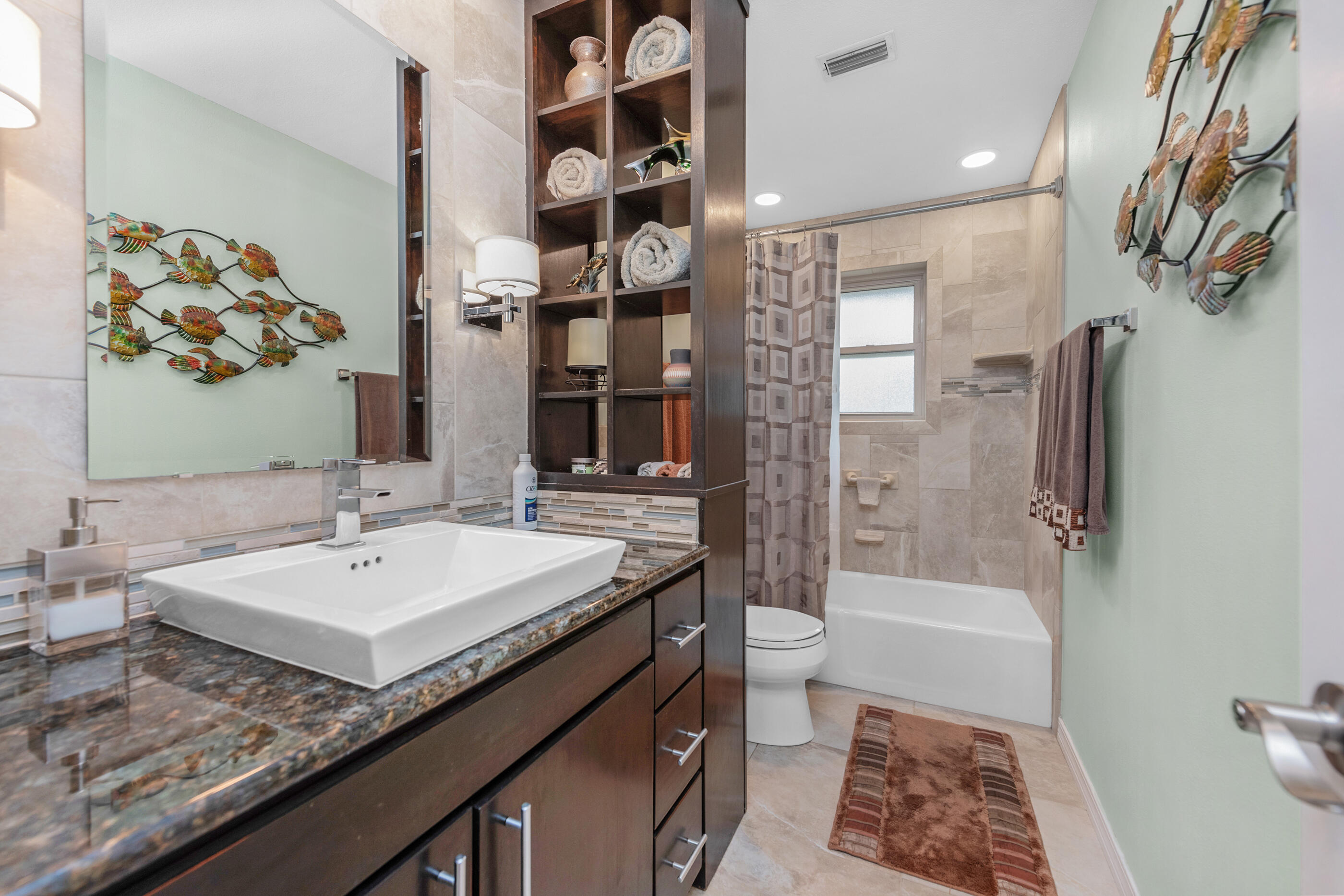 10099 Bellbrook Road Milton, FL 32583 - Photo 21 of 49 a bathroom with a tub sink and mirror