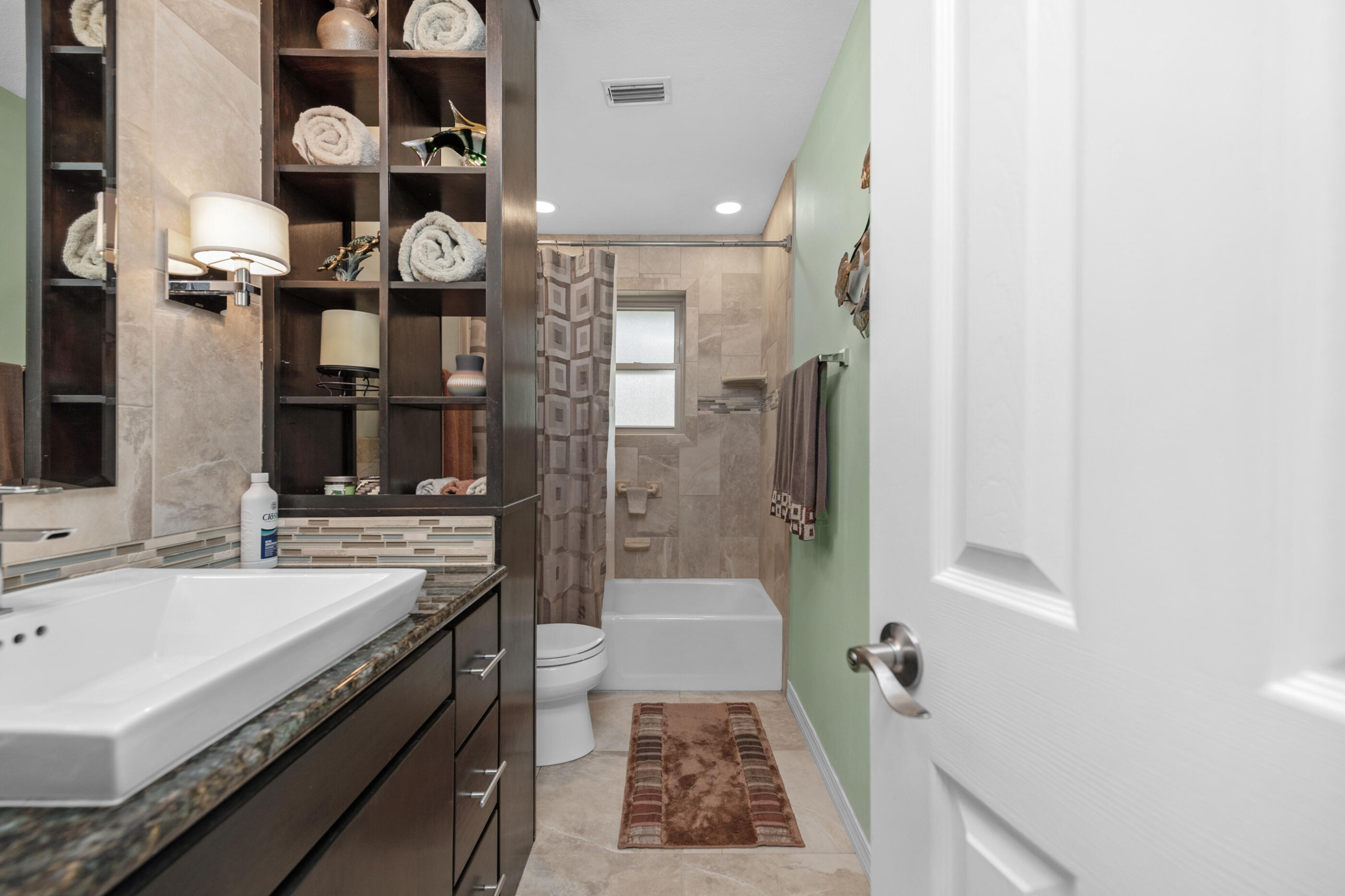 10099 Bellbrook Road Milton, FL 32583 - Photo 22 of 49 a bathroom with a sink a toilet and shower