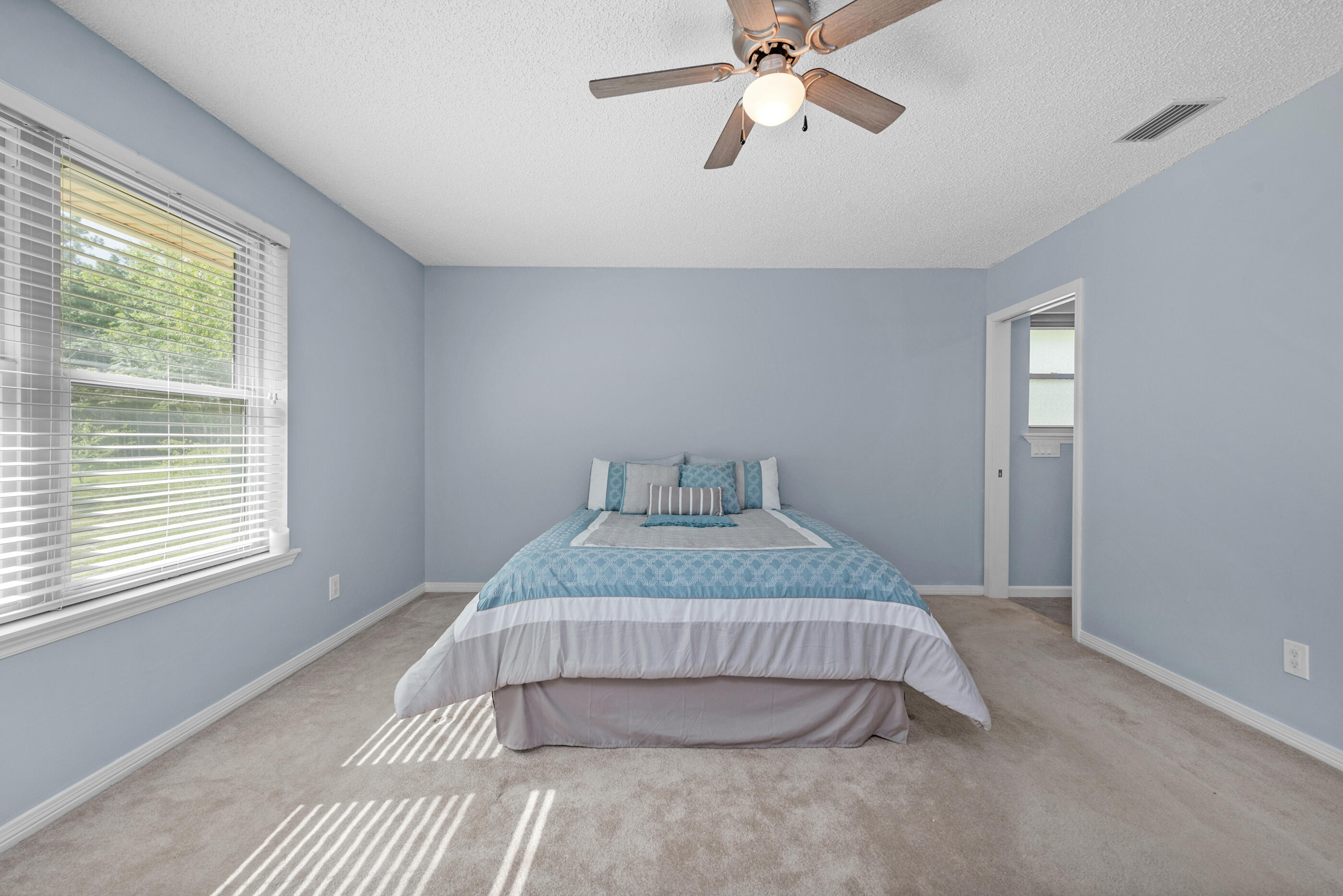 10099 Bellbrook Road Milton, FL 32583 - Photo 24 of 49 a bedroom with a bed and window