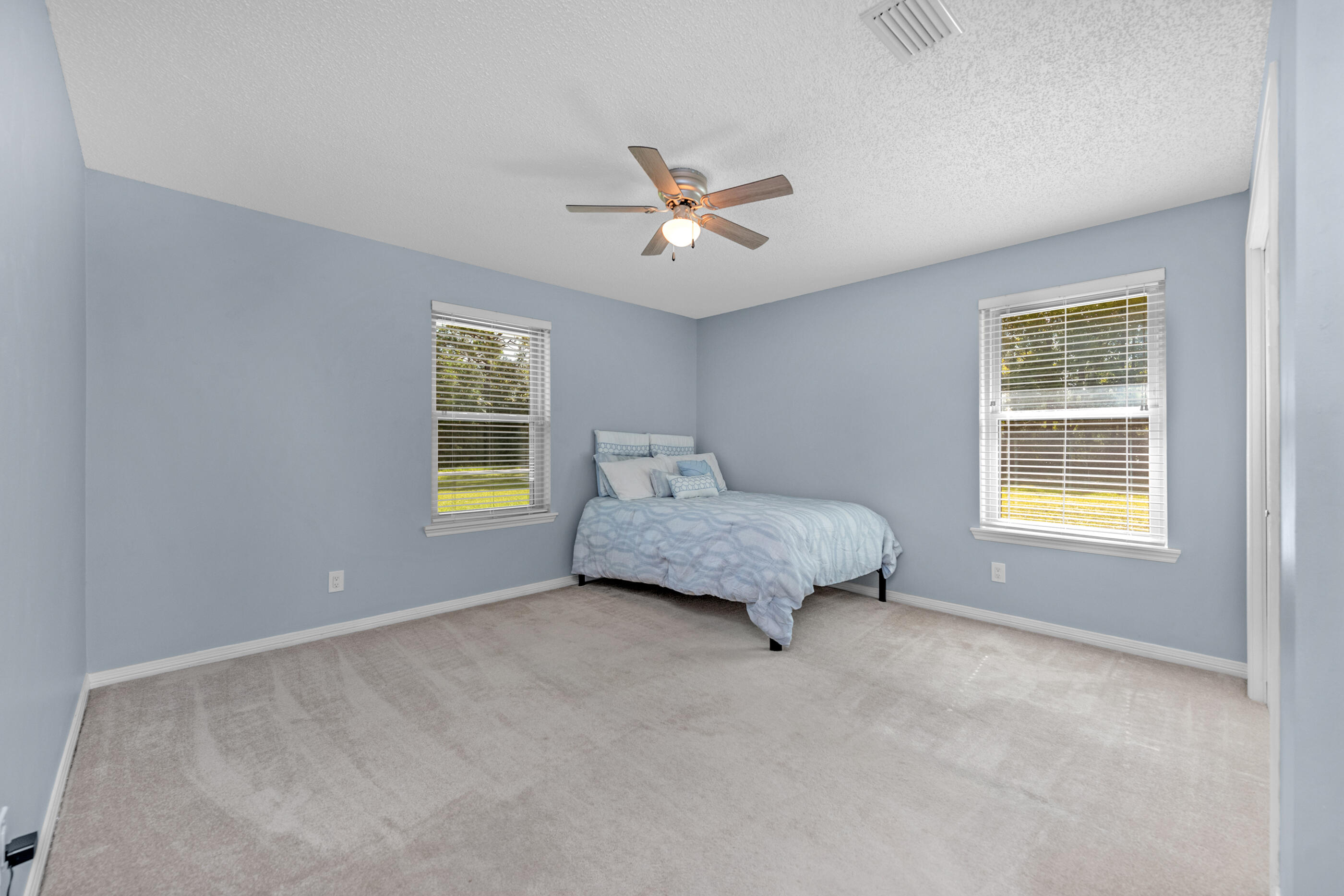 10099 Bellbrook Road Milton, FL 32583 - Photo 27 of 49 a bedroom with a bed and window