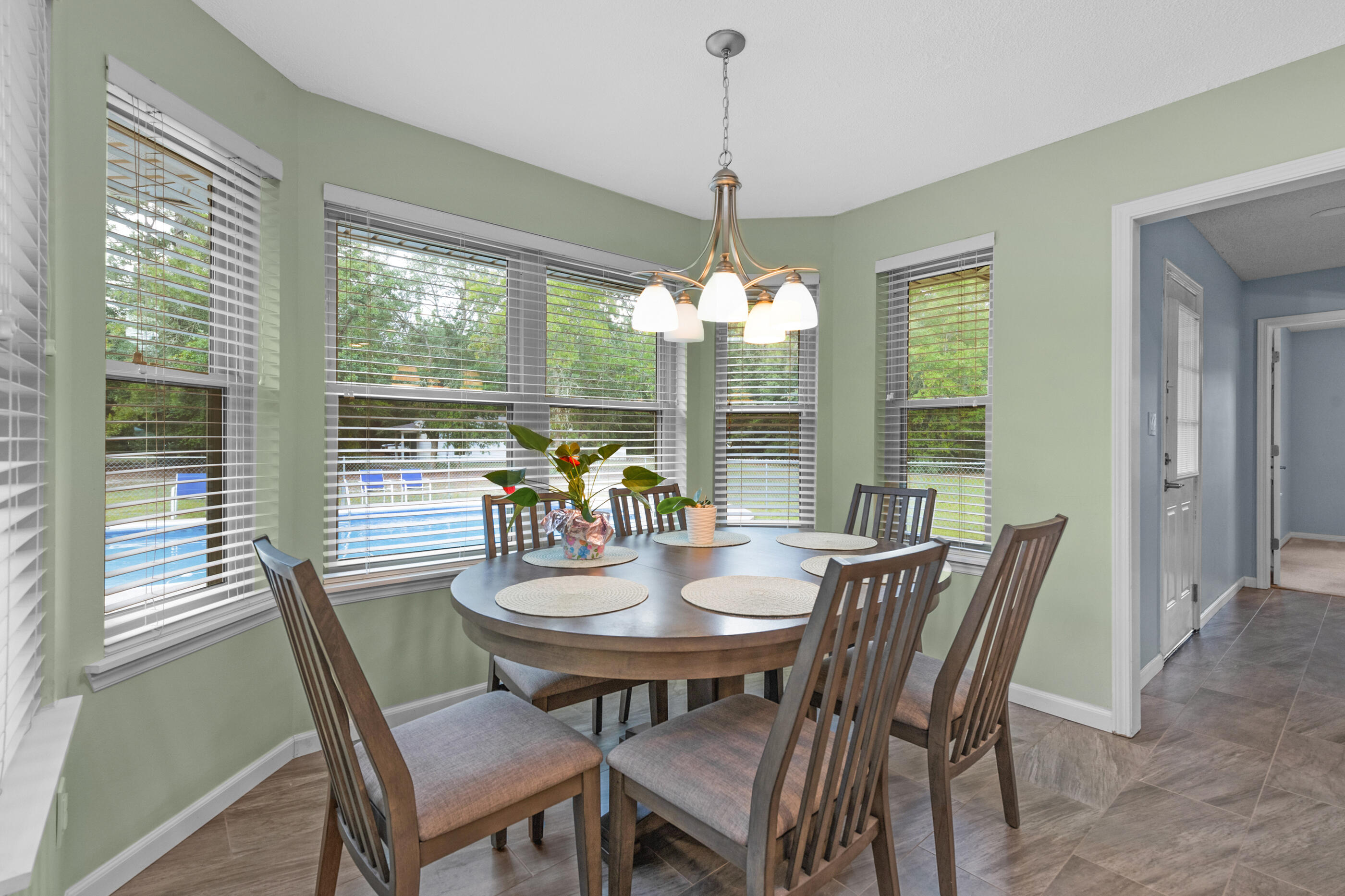 10099 Bellbrook Road Milton, FL 32583 - Photo 30 of 49 a view of a dining room with furniture window and outside view