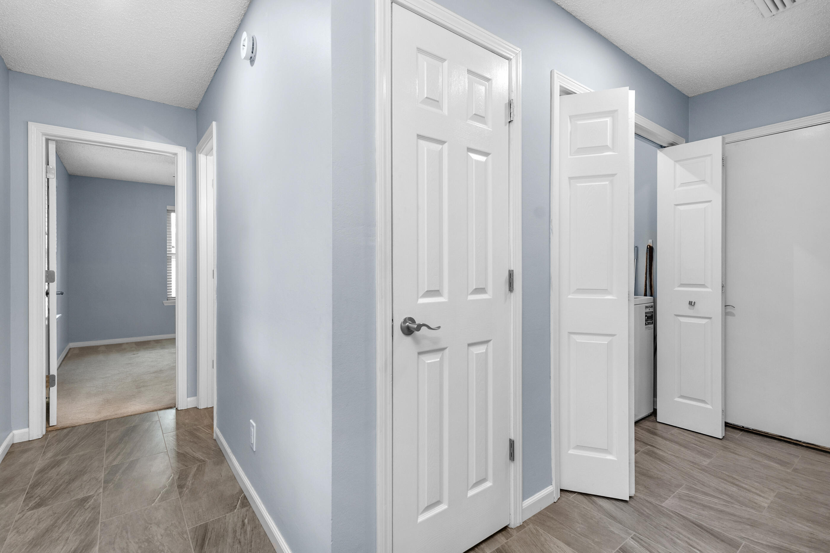 10099 Bellbrook Road Milton, FL 32583 - Photo 32 of 49 wooden floor with white walls