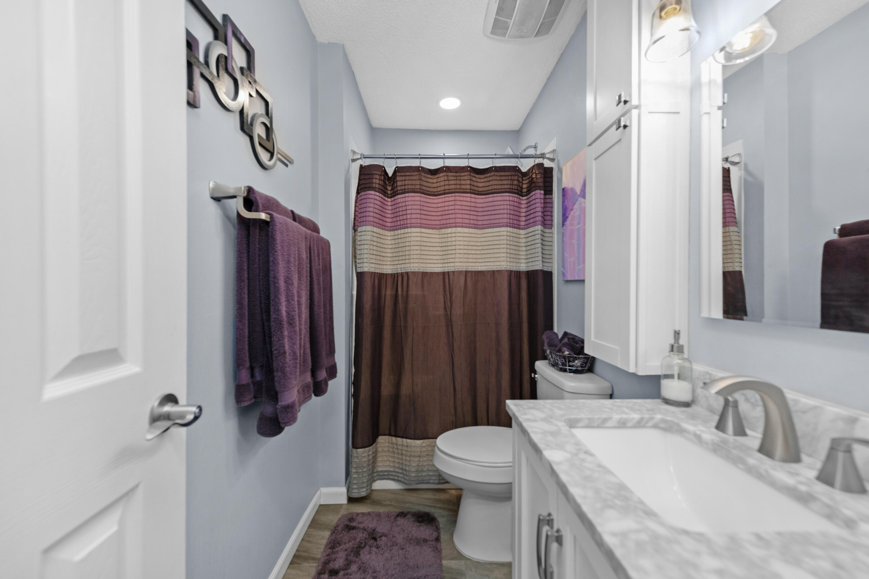 10099 Bellbrook Road Milton, FL 32583 - Photo 34 of 49 a bathroom with a sink toilet and shower