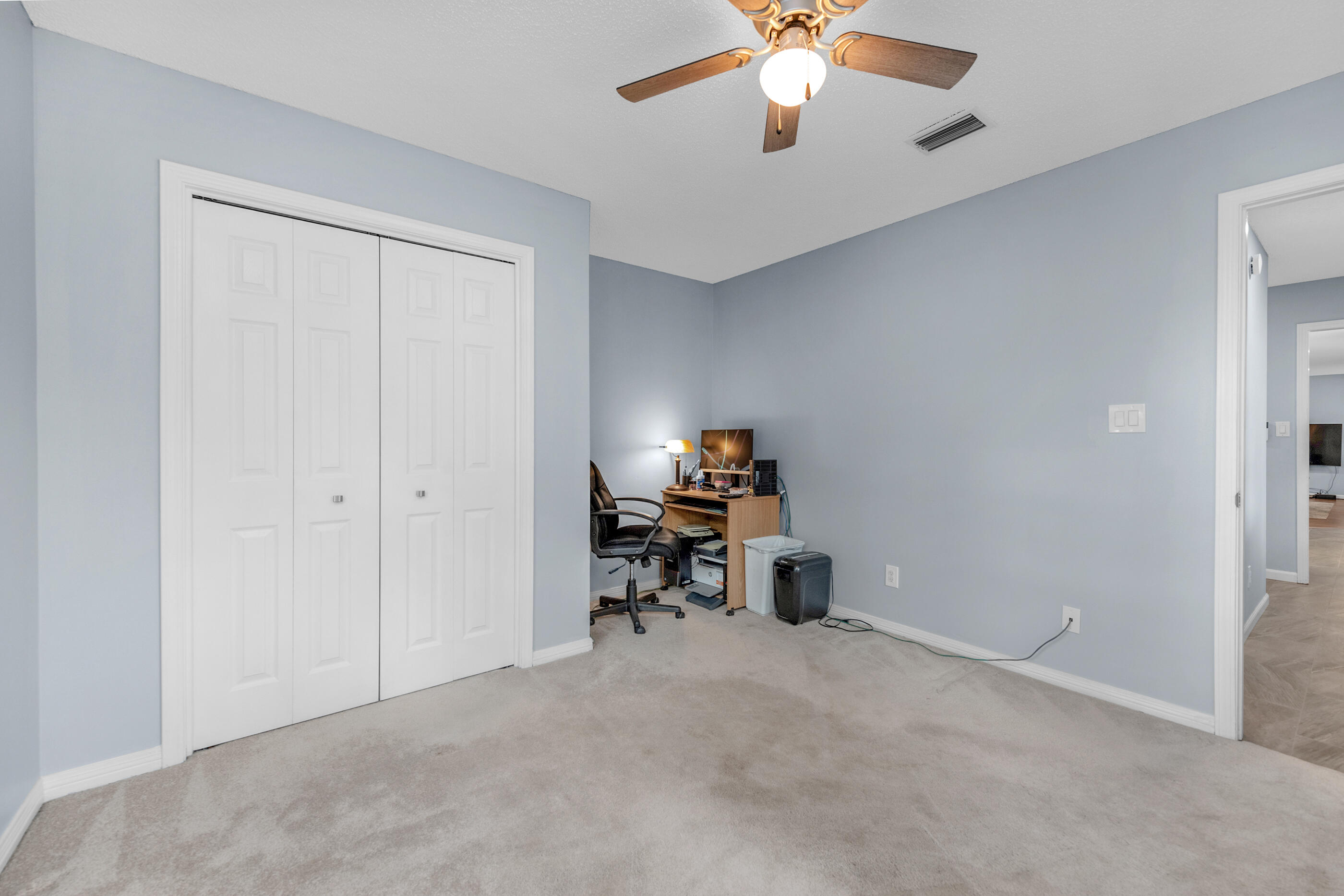 10099 Bellbrook Road Milton, FL 32583 - Photo 37 of 49 an empty room with a ceiling fan and a window