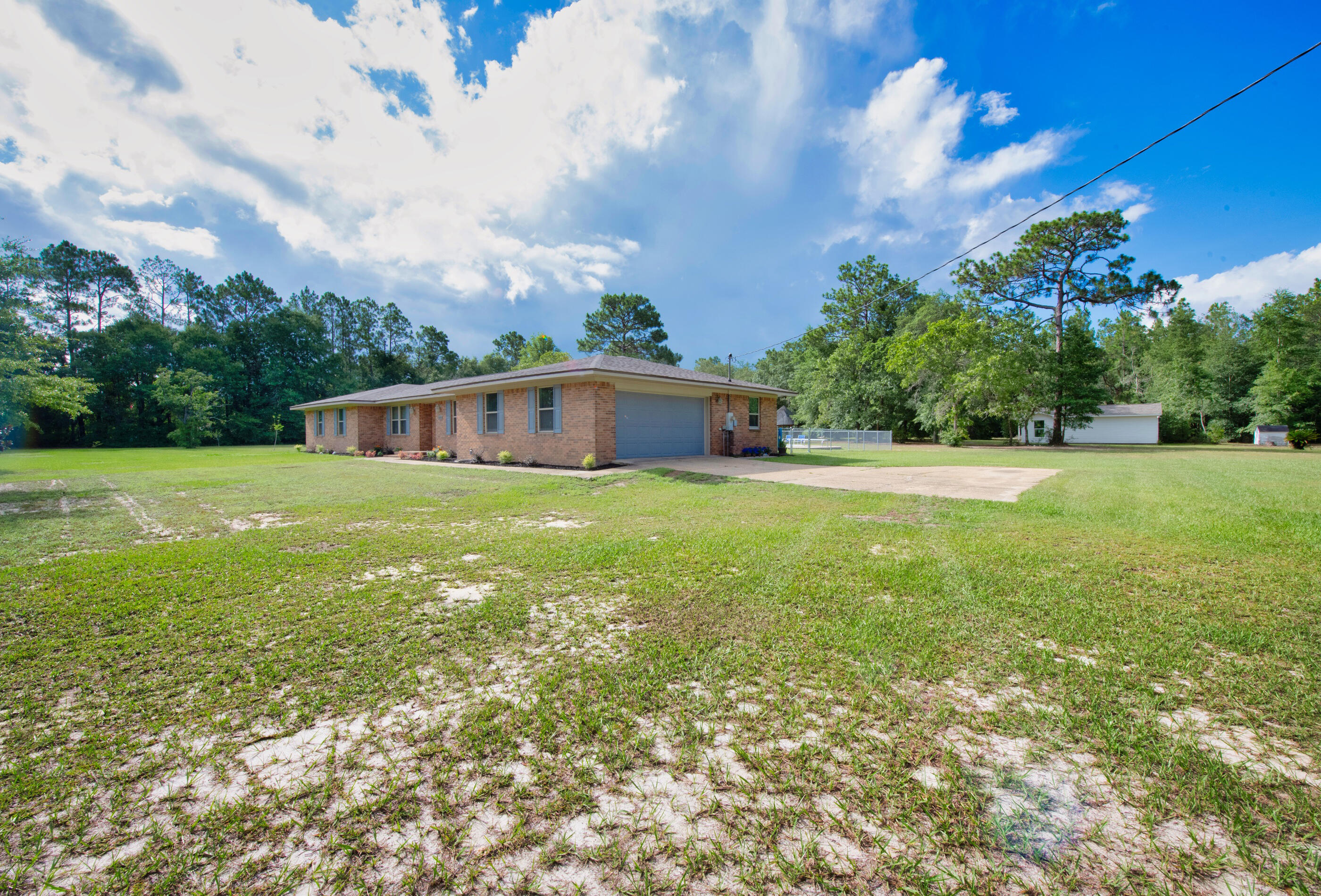 10099 Bellbrook Road Milton, FL 32583 - Photo 4 of 49 a view of a house with a big yard