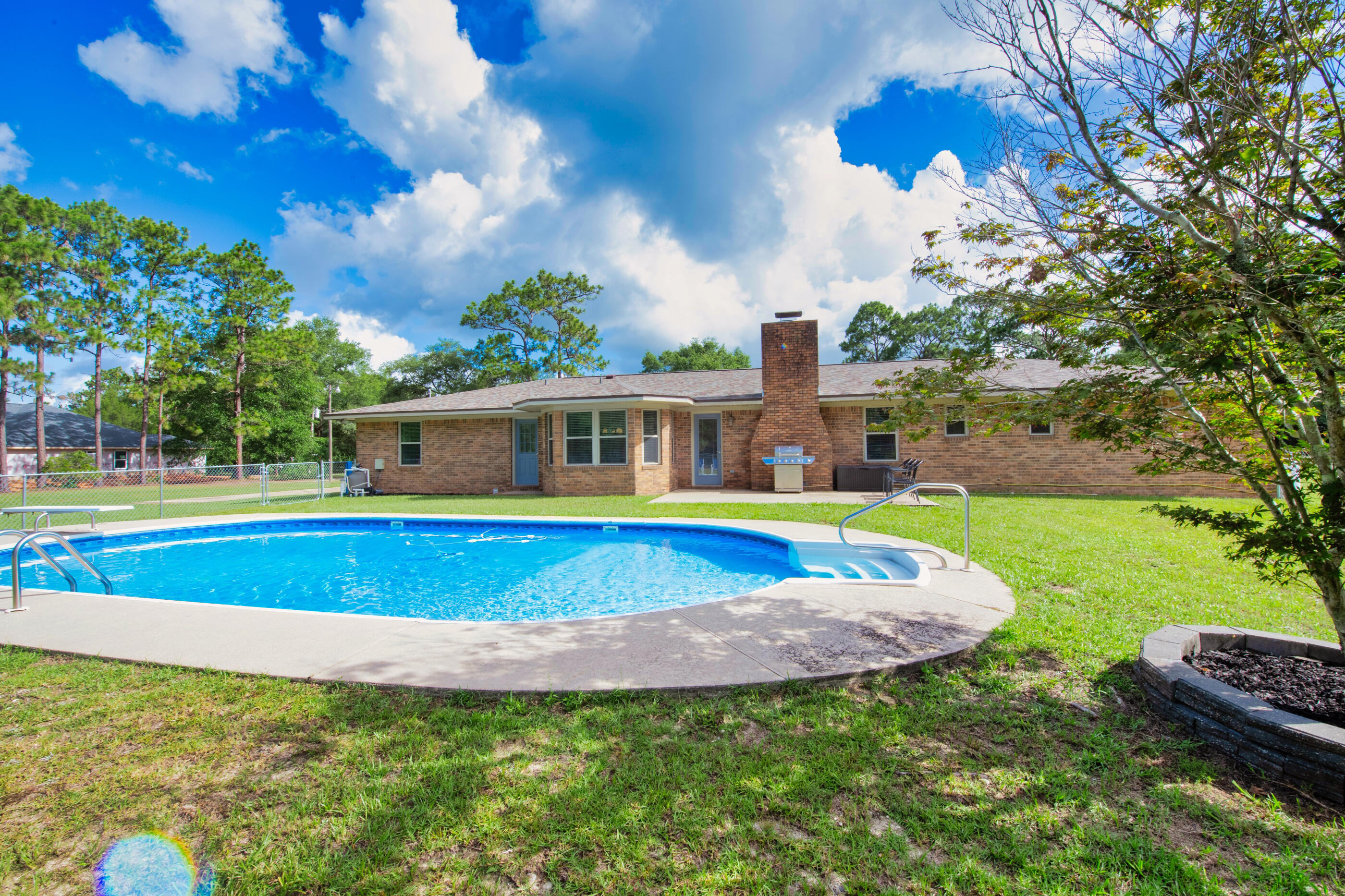 10099 Bellbrook Road Milton, FL 32583 - Photo 42 of 49 a view of outdoor space yard swimming pool and green space