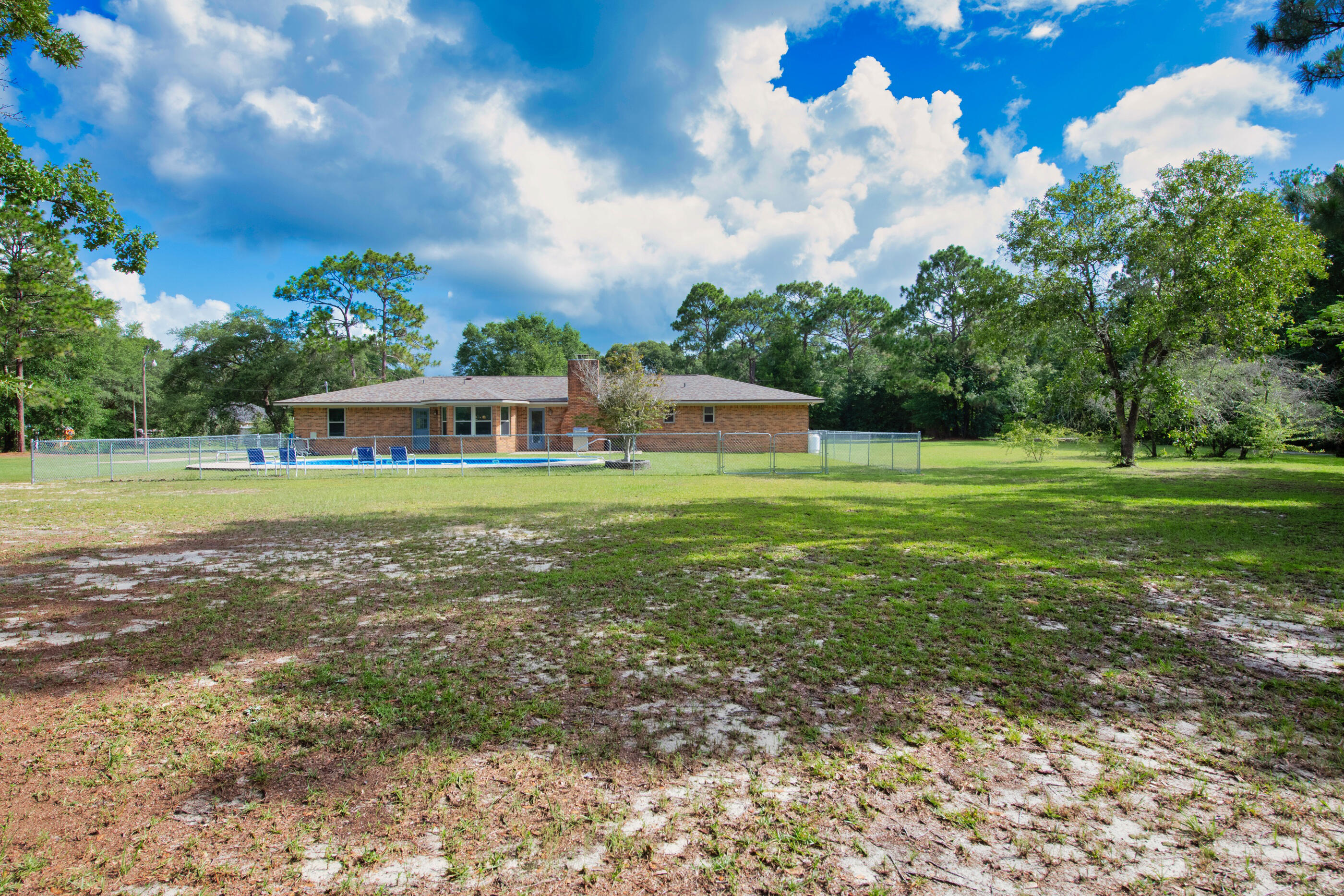 10099 Bellbrook Road Milton, FL 32583 - Photo 45 of 49 a view of a house with a big yard