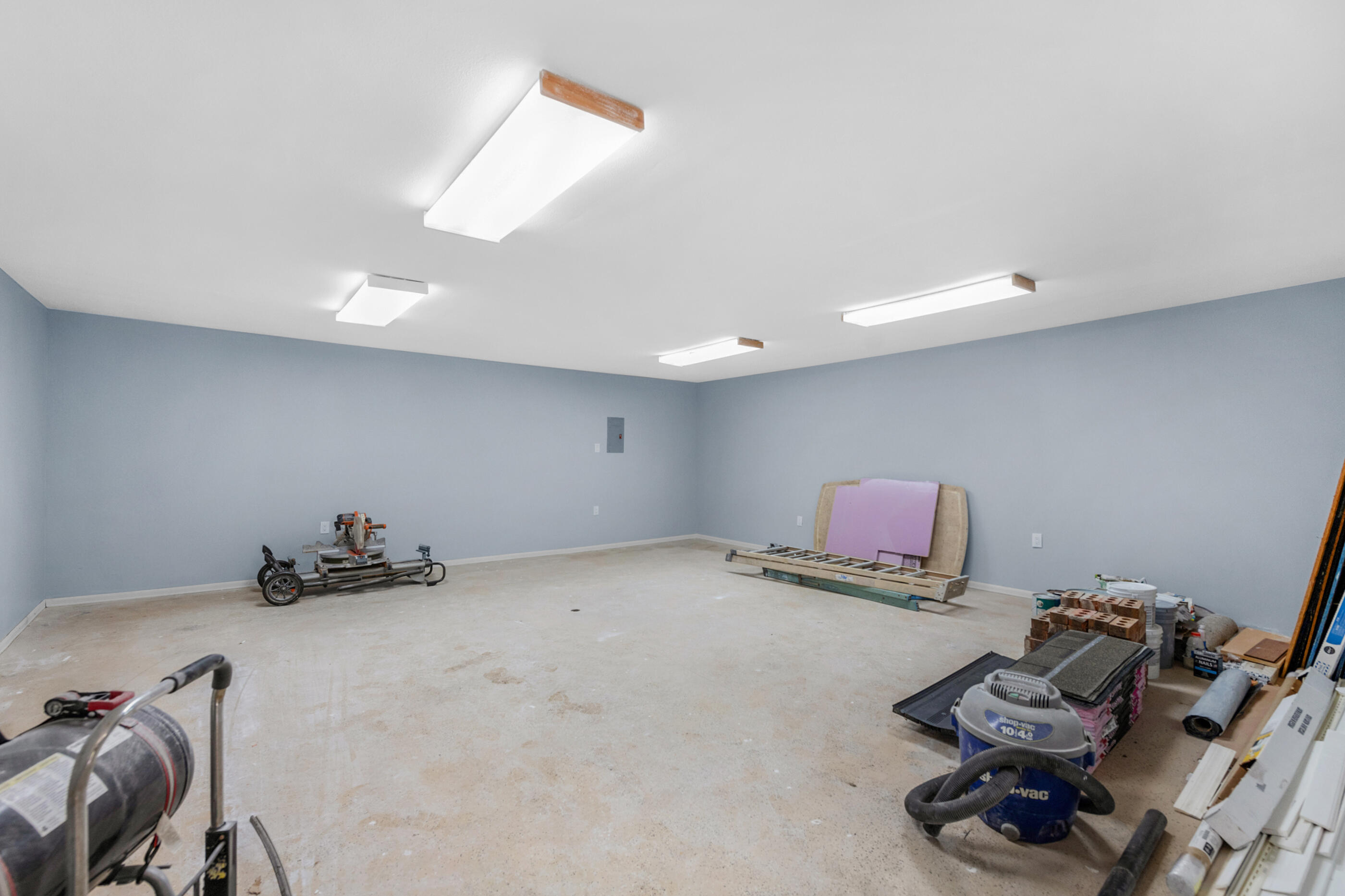 10099 Bellbrook Road Milton, FL 32583 - Photo 48 of 49 a room with furniture and a wooden floor
