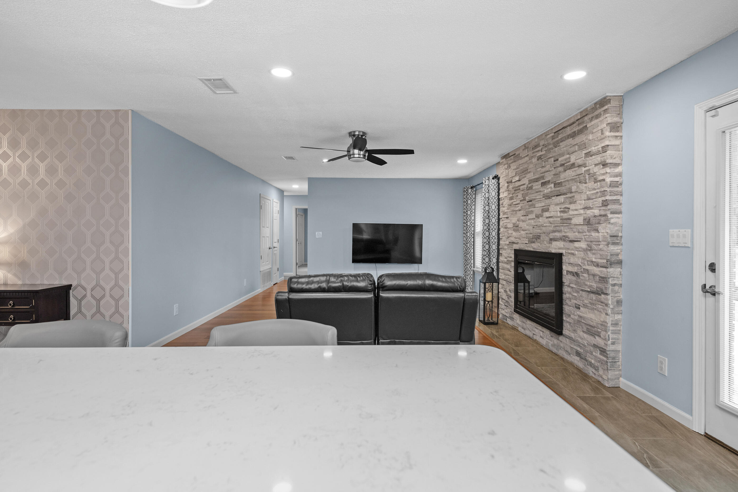 10099 Bellbrook Road Milton, FL 32583 - Photo 5 of 49 a large bedroom with a bed and a fireplace