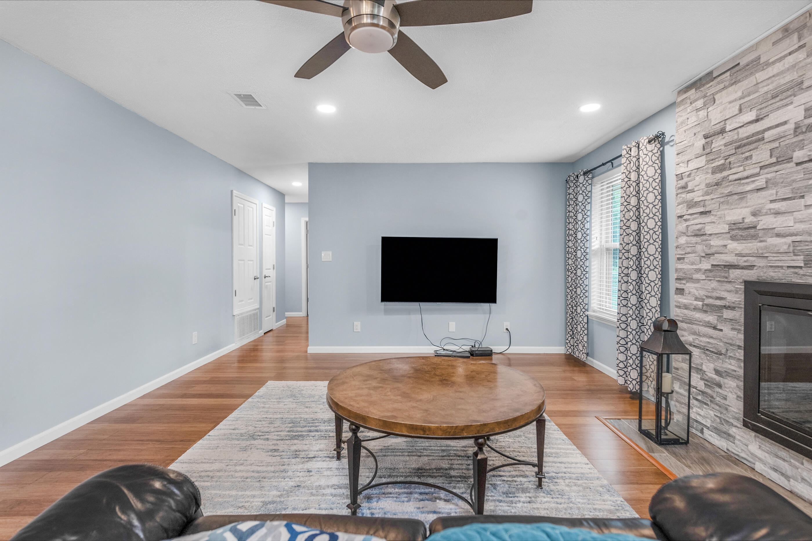 10099 Bellbrook Road Milton, FL 32583 - Photo 6 of 49 a living room with furniture and a flat screen tv