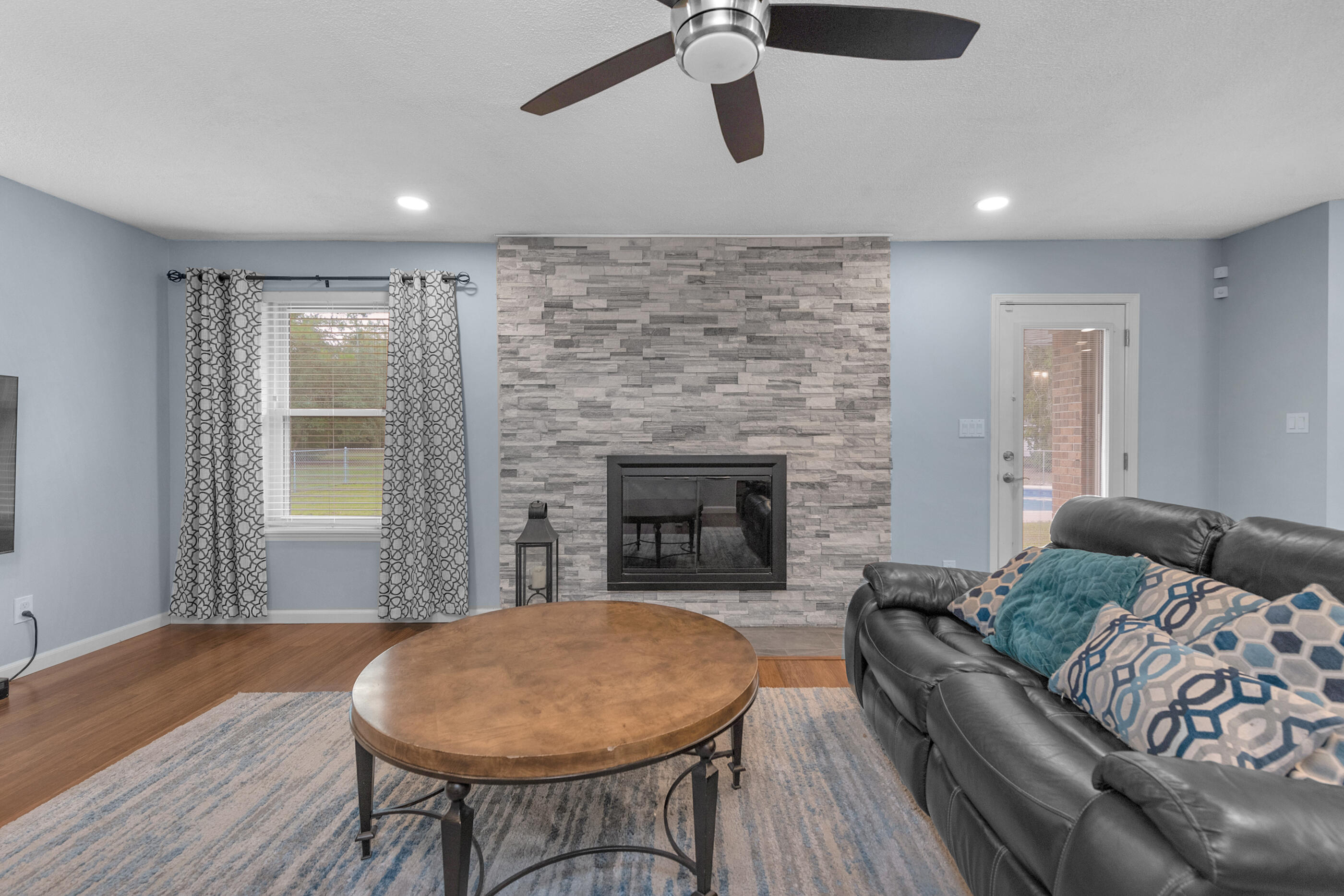 10099 Bellbrook Road Milton, FL 32583 - Photo 8 of 49 a living room with furniture and a fireplace