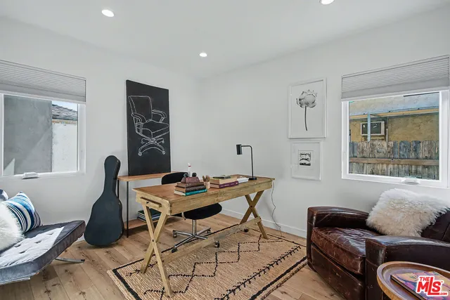 a work room with furniture and window