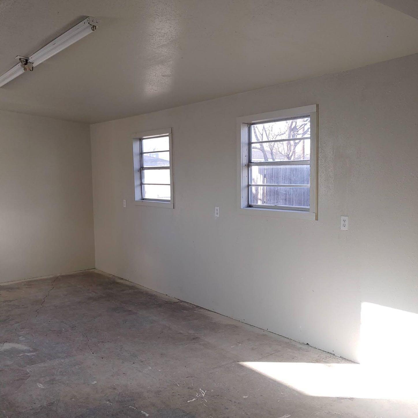 4304 South Hayden Street Amarillo, TX 79110 - Photo 18 of 22 an empty room with windows