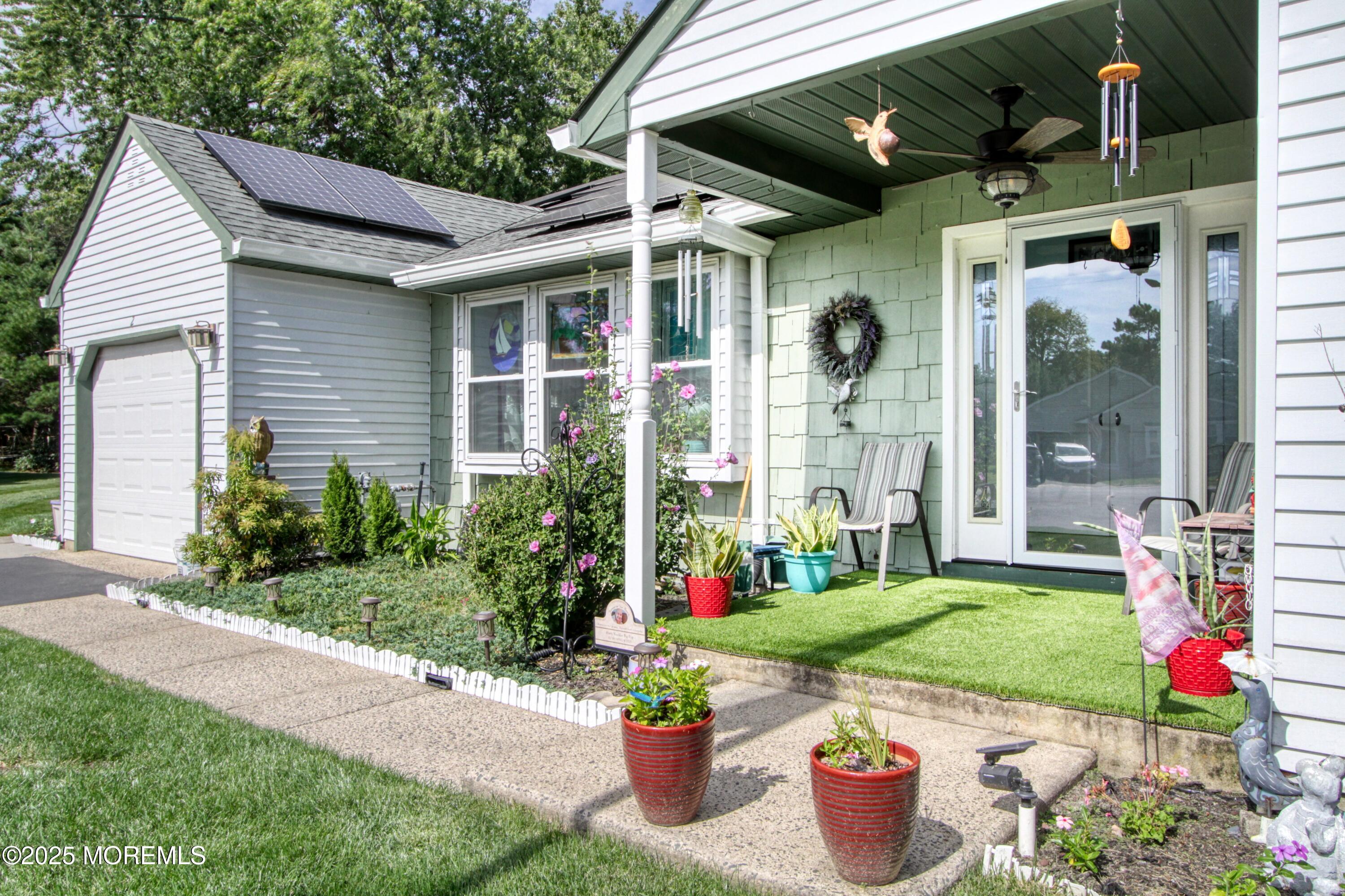 2 Norwood Court Whiting, NJ 08759 - Photo 12 of 22 a front view of a house with a yard and potted plants