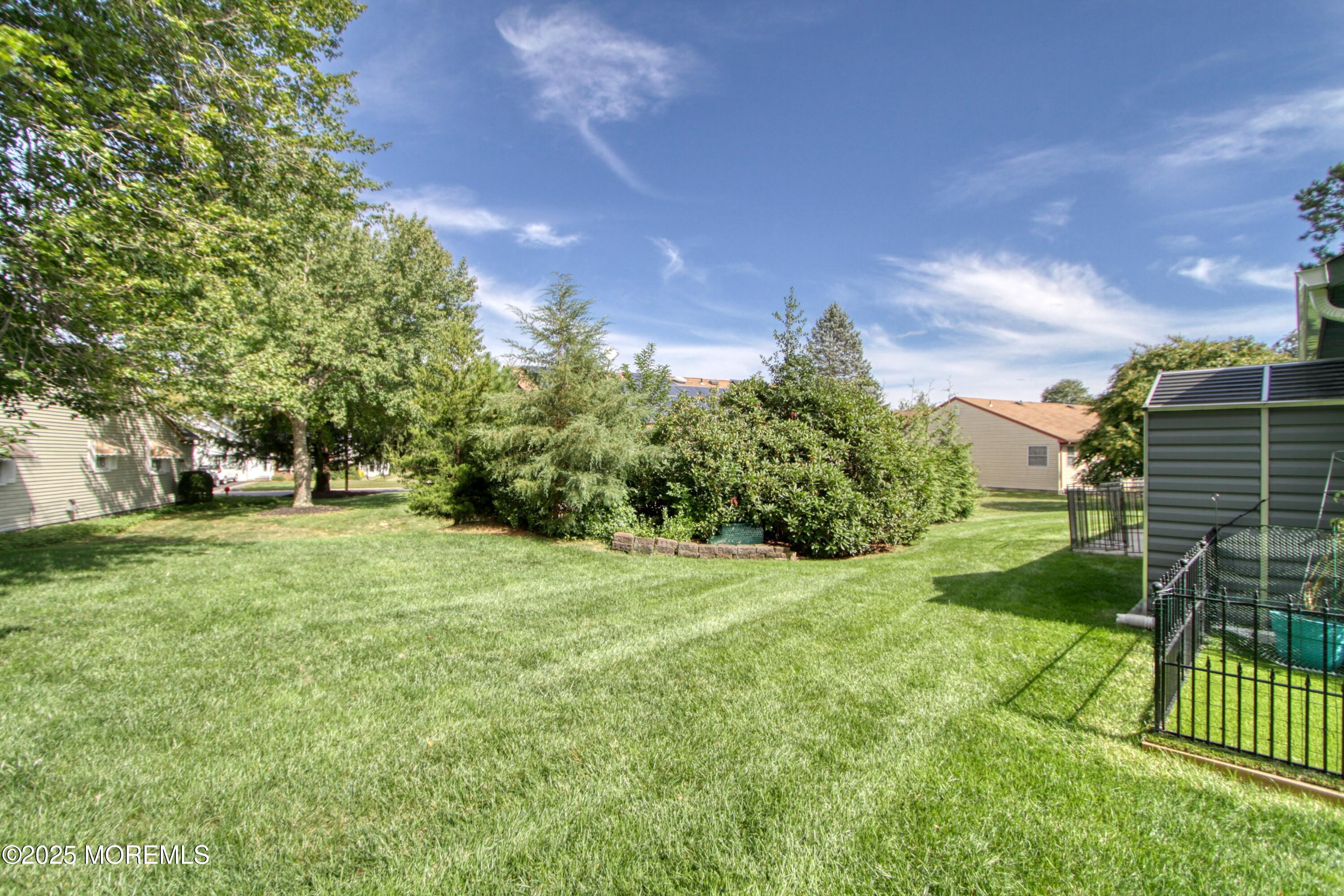2 Norwood Court Whiting, NJ 08759 - Photo 17 of 22 a view of a yard with a house in the background