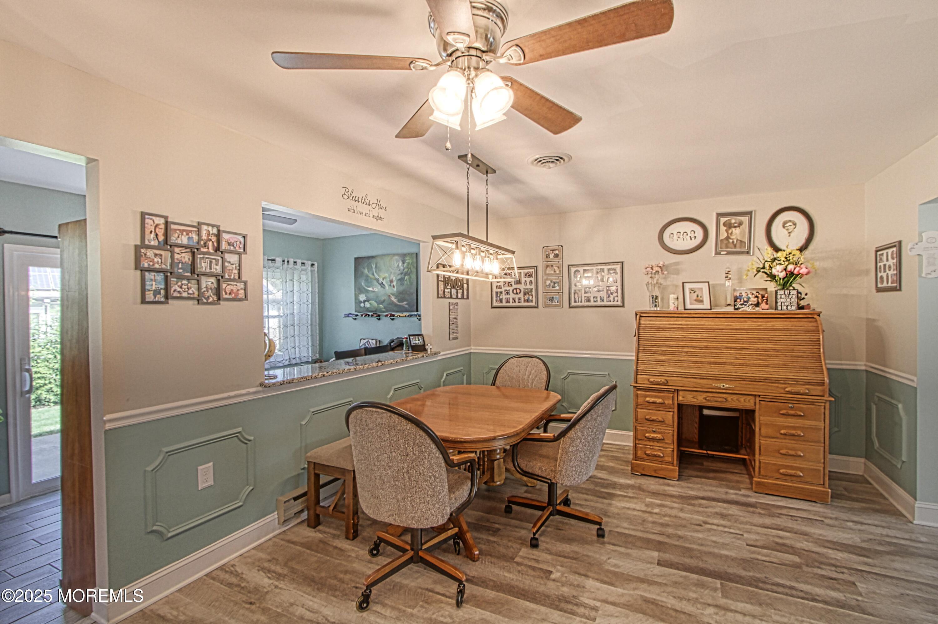 2 Norwood Court Whiting, NJ 08759 - Photo 4 of 22 a dining room with furniture a fireplace and a chandelier