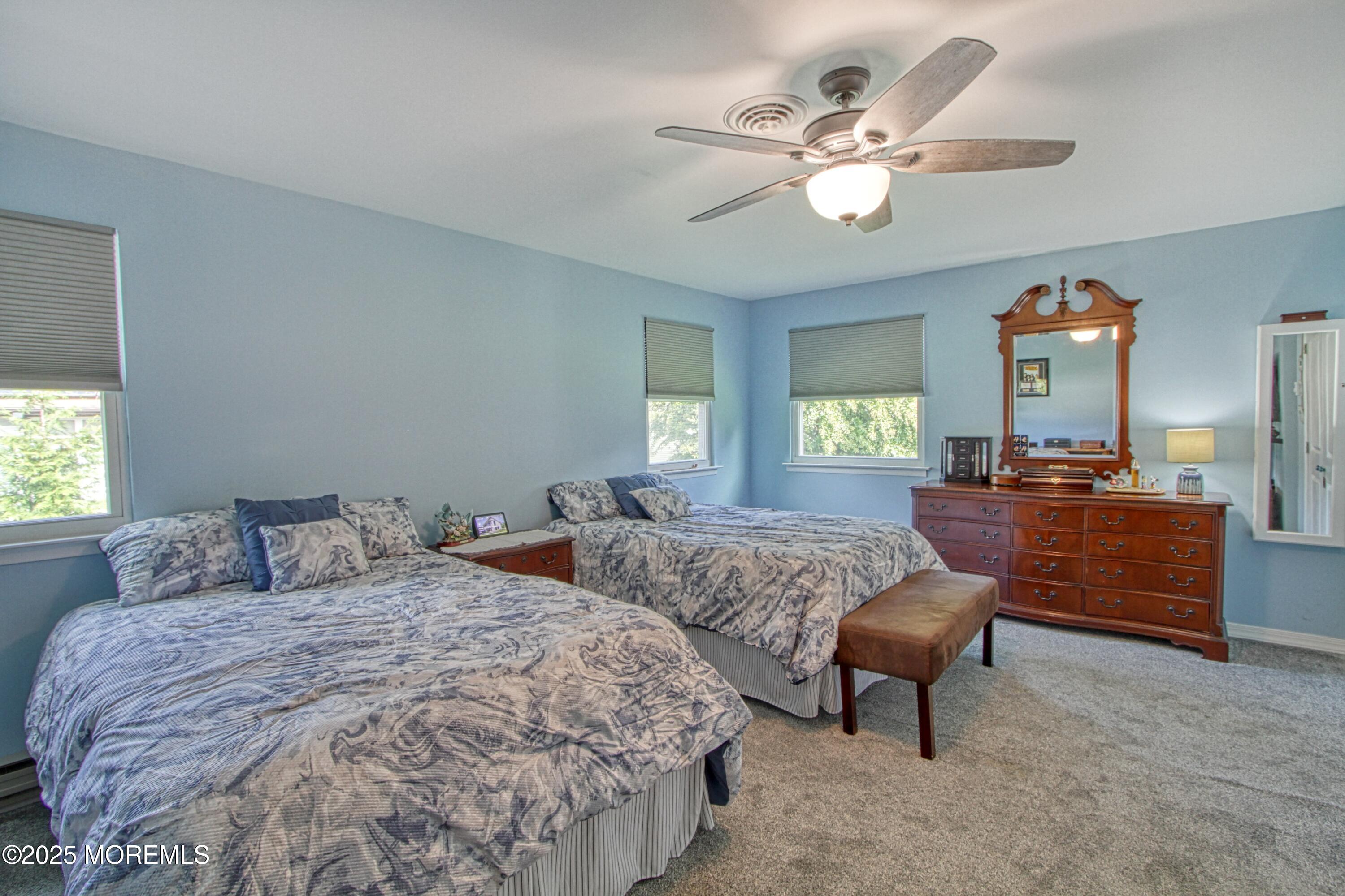 2 Norwood Court Whiting, NJ 08759 - Photo 7 of 22 a bedroom with two beds and a chandelier