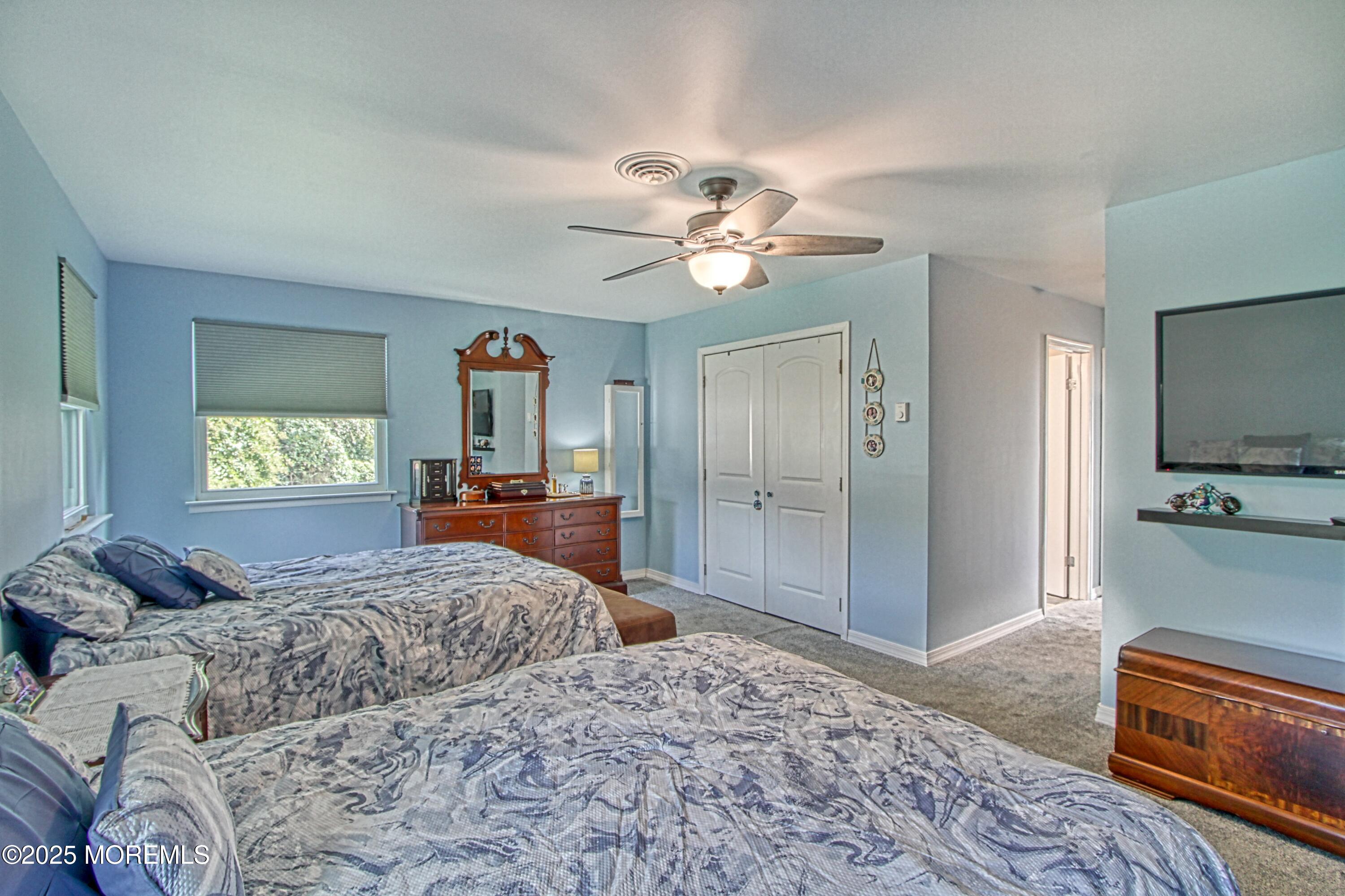 2 Norwood Court Whiting, NJ 08759 - Photo 9 of 22 a bedroom with a bed and a chandelier