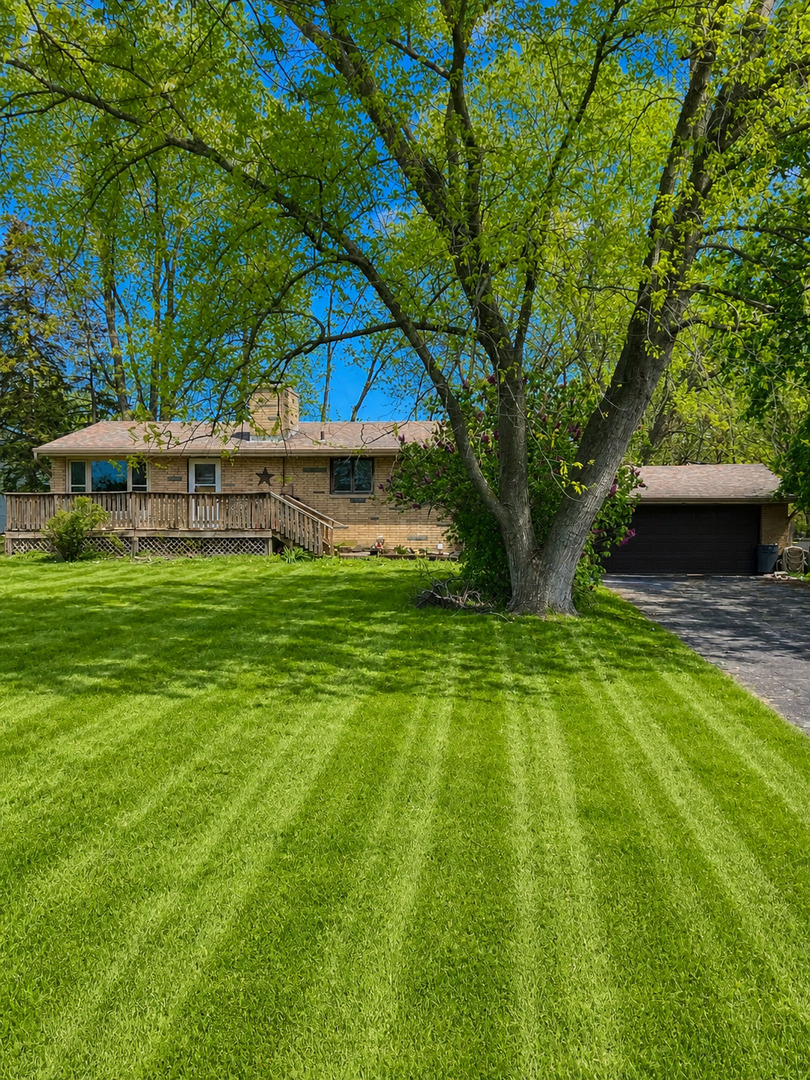 a view of a house with a big yard