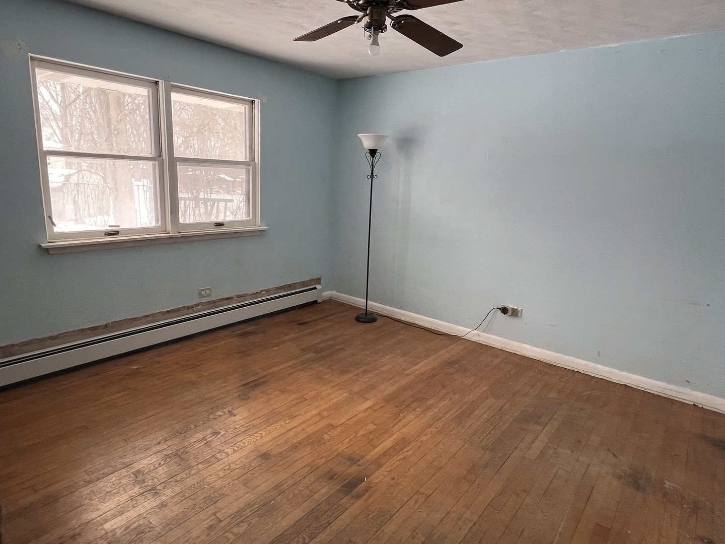 13980 Stonegate Road Wadsworth, IL 60083 - Photo 13 of 20 a view of a room with a window and a ceiling fan
