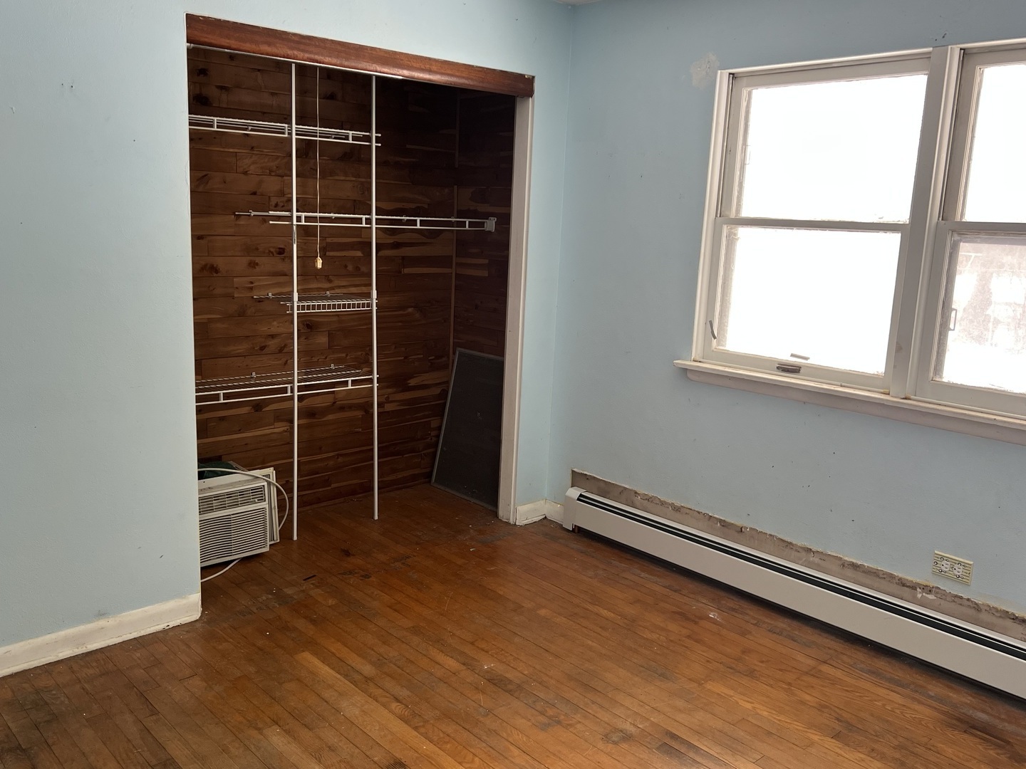 13980 Stonegate Road Wadsworth, IL 60083 - Photo 14 of 20 an empty room with wooden floor and windows