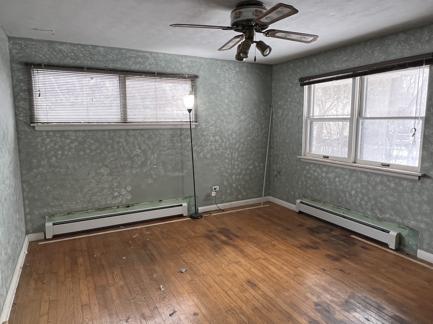 13980 Stonegate Road Wadsworth, IL 60083 - Photo 16 of 20 a view of an empty room with a window and wooden floor