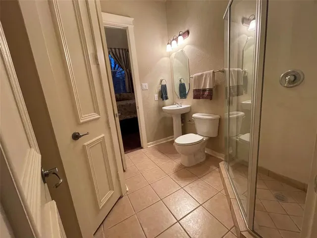 a view of hallway with stairs and wooden floor
