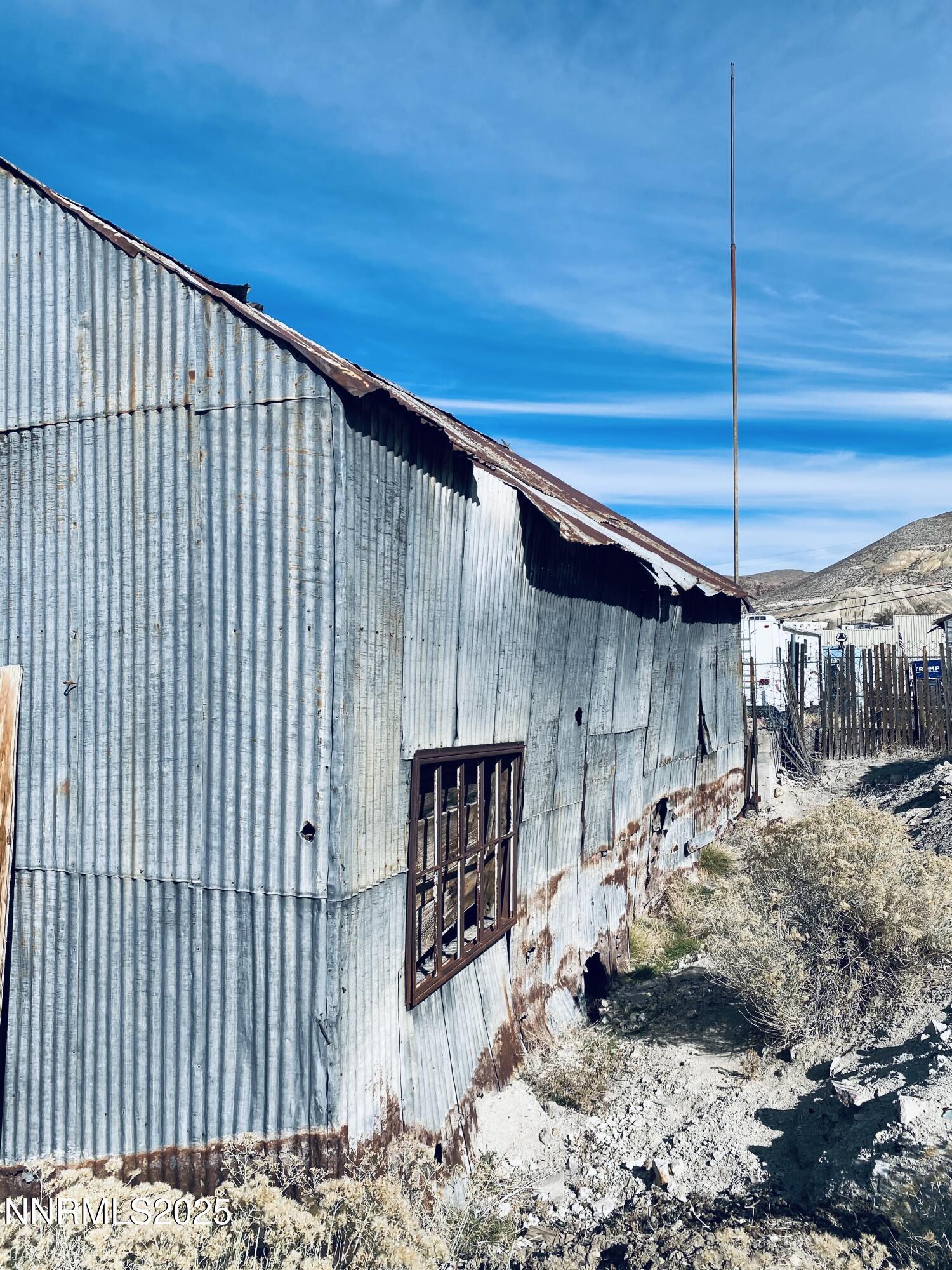 237 Summit Street Tonopah, NV 89049 - Photo 2 of 11 a view of a backyard with wooden fence