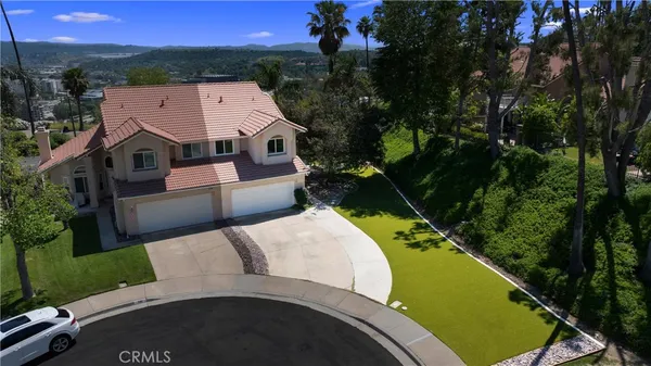 a aerial view of a house with a yard