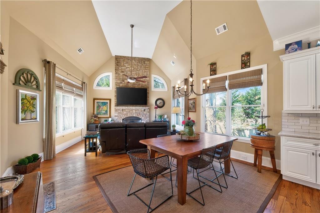 110 Roxbury Row Alpharetta, GA 30004 - Photo 12 of 45 a view of a dining room with furniture window and wooden floor