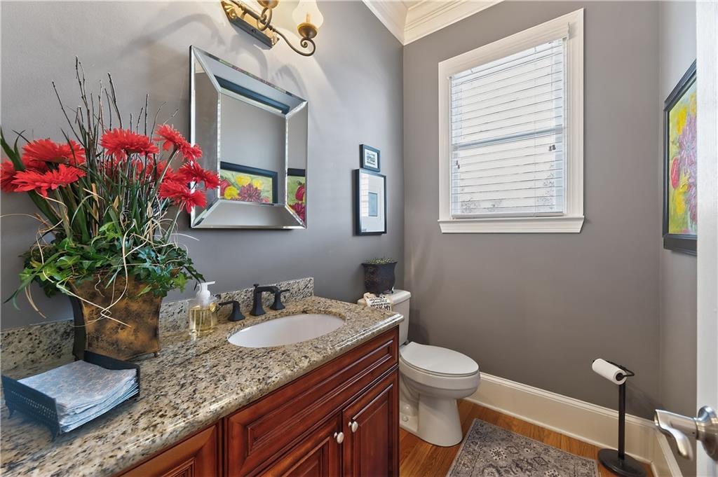 110 Roxbury Row Alpharetta, GA 30004 - Photo 14 of 45 a bathroom with a granite countertop sink a toilet and a mirror