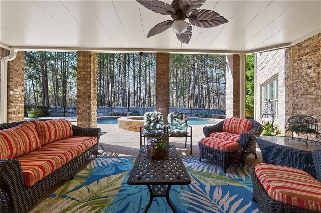 110 Roxbury Row Alpharetta, GA 30004 - Photo 31 of 45 a living room with furniture and a large window