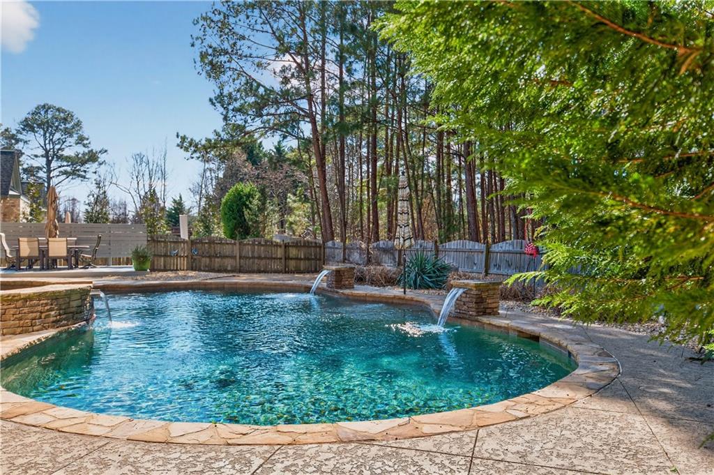 110 Roxbury Row Alpharetta, GA 30004 - Photo 35 of 45 a view of a swimming pool with a sitting area