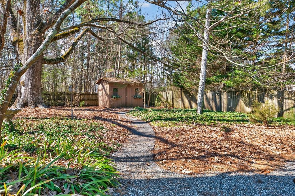 110 Roxbury Row Alpharetta, GA 30004 - Photo 37 of 45 a view of a yard with plants and trees