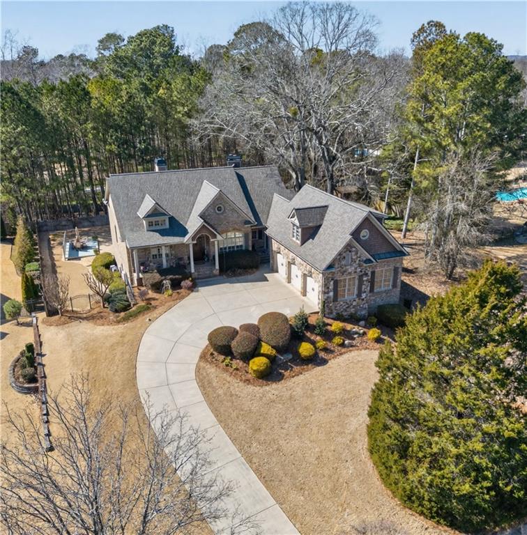 110 Roxbury Row Alpharetta, GA 30004 - Photo 39 of 45 an aerial view of a house with garden space and sitting area