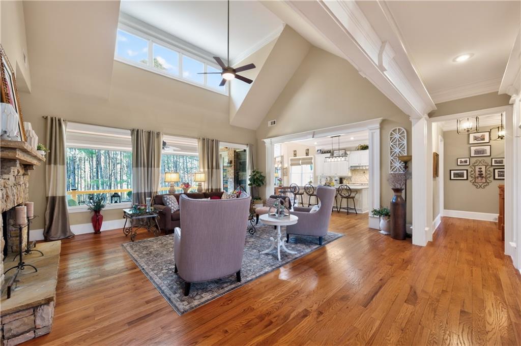 110 Roxbury Row Alpharetta, GA 30004 - Photo 4 of 45 a living room with furniture large window and wooden floor