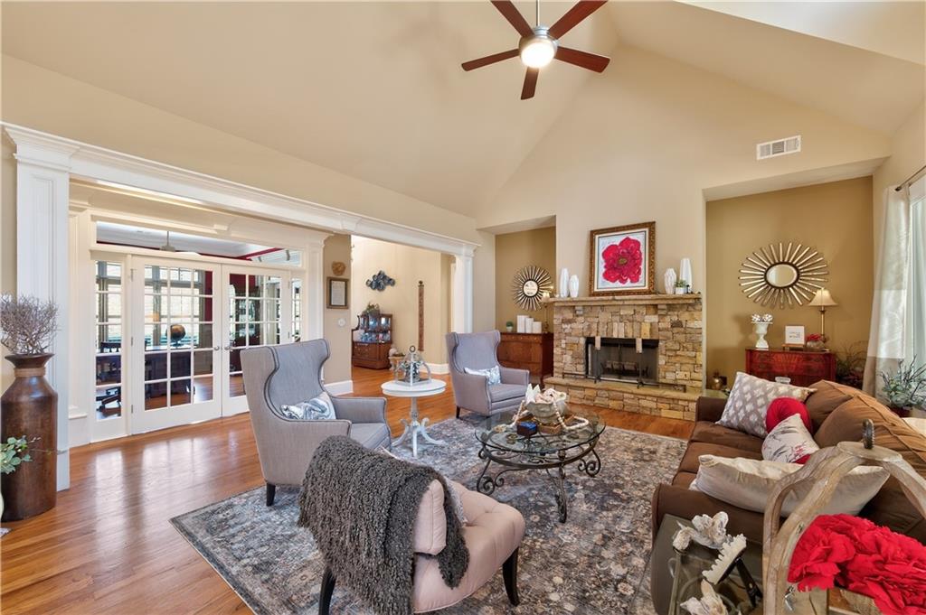 110 Roxbury Row Alpharetta, GA 30004 - Photo 6 of 45 a living room with furniture and wooden floor