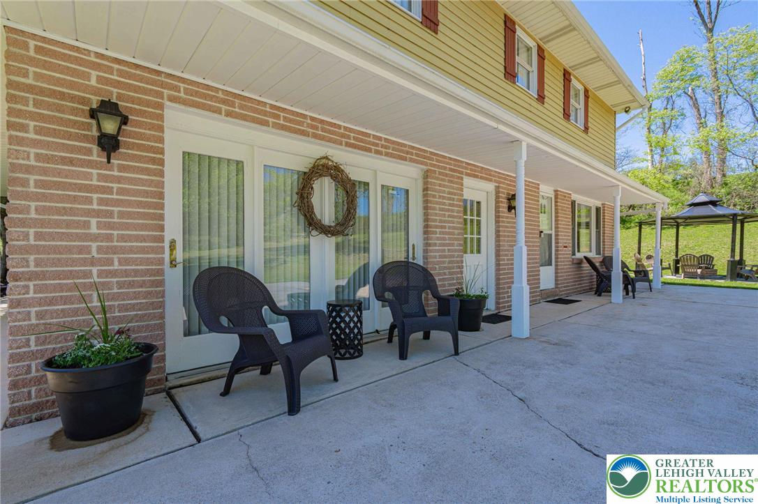 3857 Friedens Road Slatington, PA 18080 - Photo 13 of 75 This inviting home offers a welcoming patio, perfect for enjoying outdoor moments.