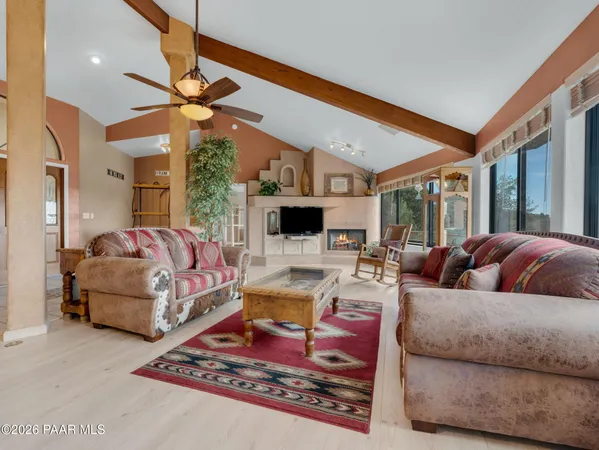a outdoor living space with patio furniture and a large window
