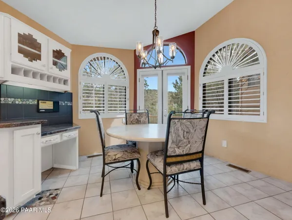 a view of a balcony with furniture