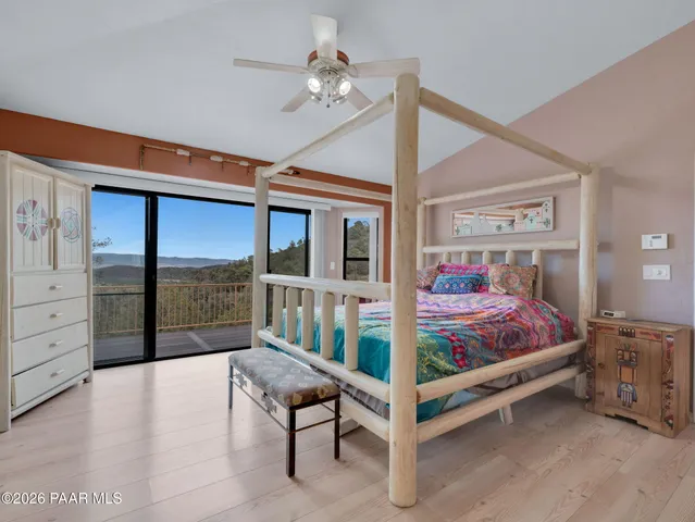 a spacious bathroom with a tub sink and mirror
