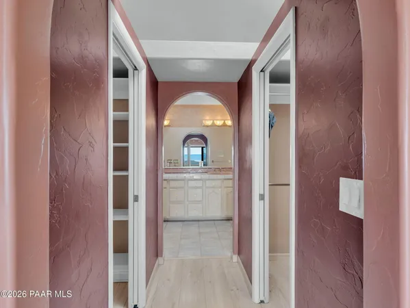 a balcony with furniture and wooden floor