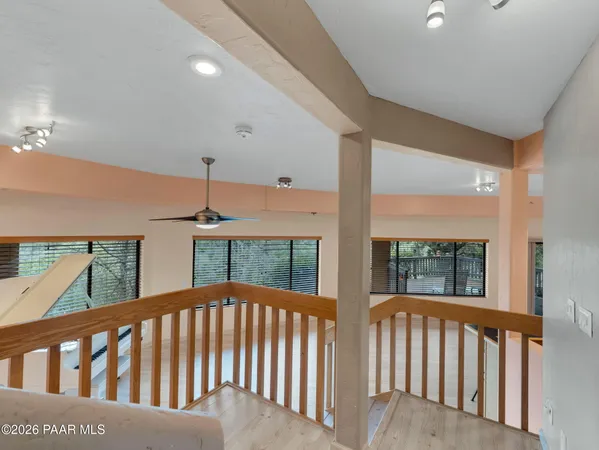 a view of balcony with wooden floor
