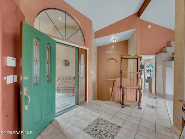 a view of entryway with a front door and wooden floor
