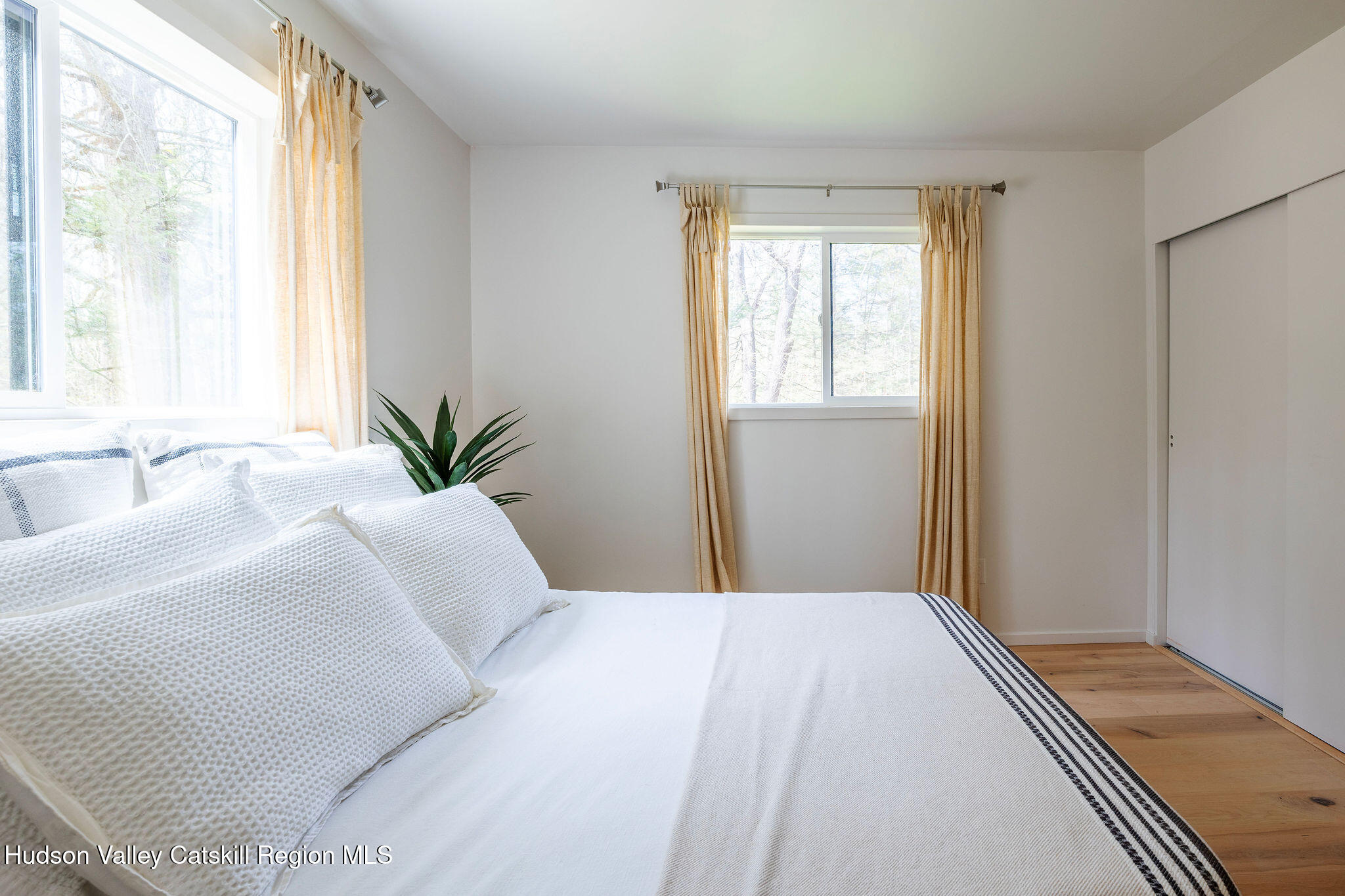 25 Upper Cherrytown Road Kerhonkson, NY 12446 - Photo 13 of 29 a bedroom with a large bed and a large window