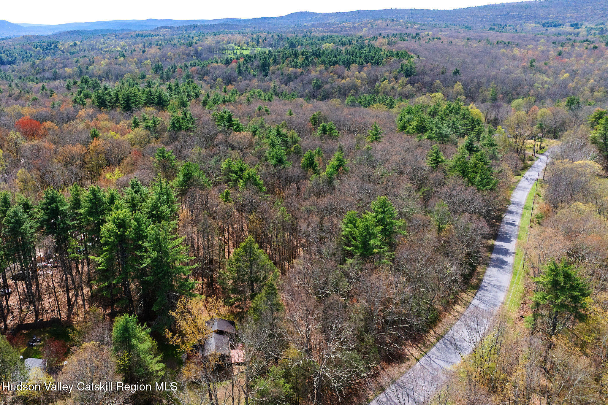25 Upper Cherrytown Road Kerhonkson, NY 12446 - Photo 24 of 29 an aerial view of green landscape with trees houses and mountain view