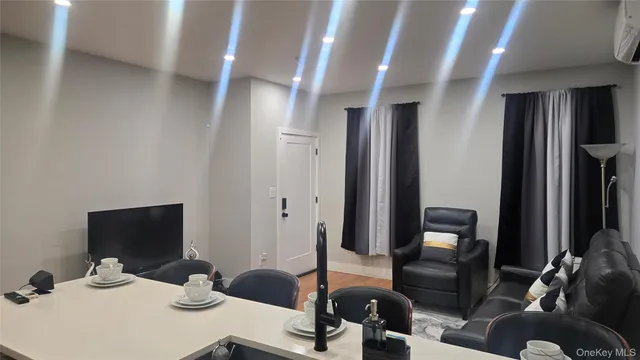 a kitchen with sink refrigerator and dining table