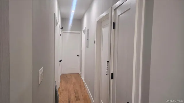 a bedroom with furniture and a mirror