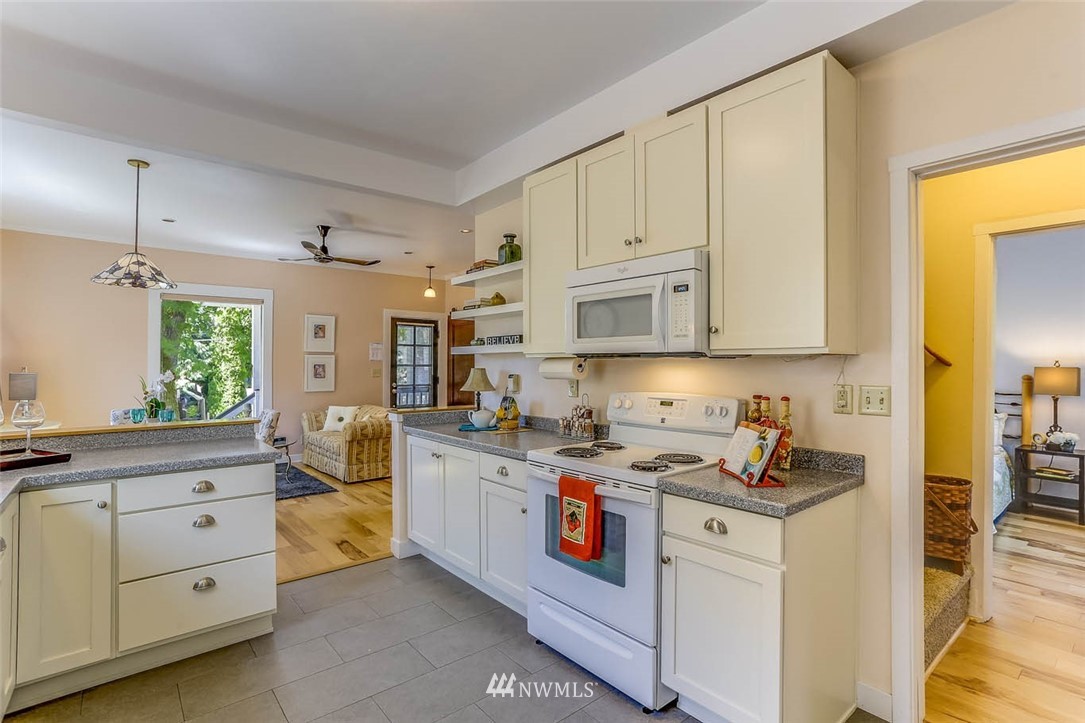 18518 103rd Avenue Northeast Bothell, WA 98011 - Photo 14 of 31 a kitchen with stainless steel appliances granite countertop a stove and a sink